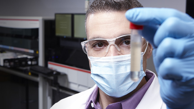 man holding a test tube
